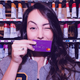 A happy customer with her Nubank card.